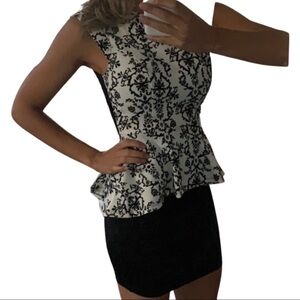 Black and white peplum dress with lace back
